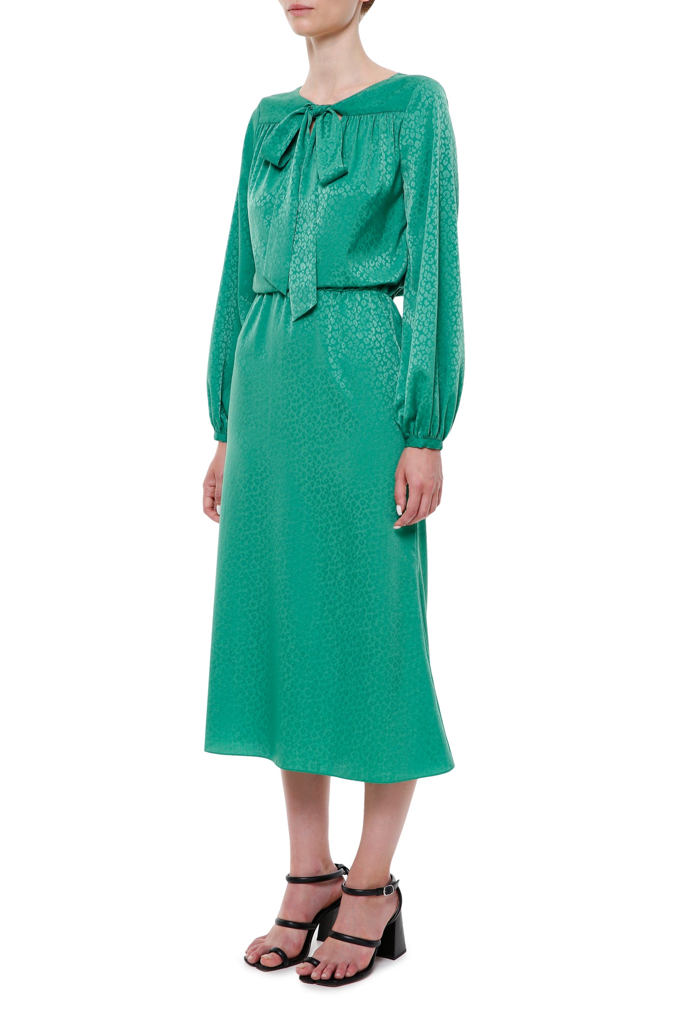 Green jacquard dress with ties on the neck