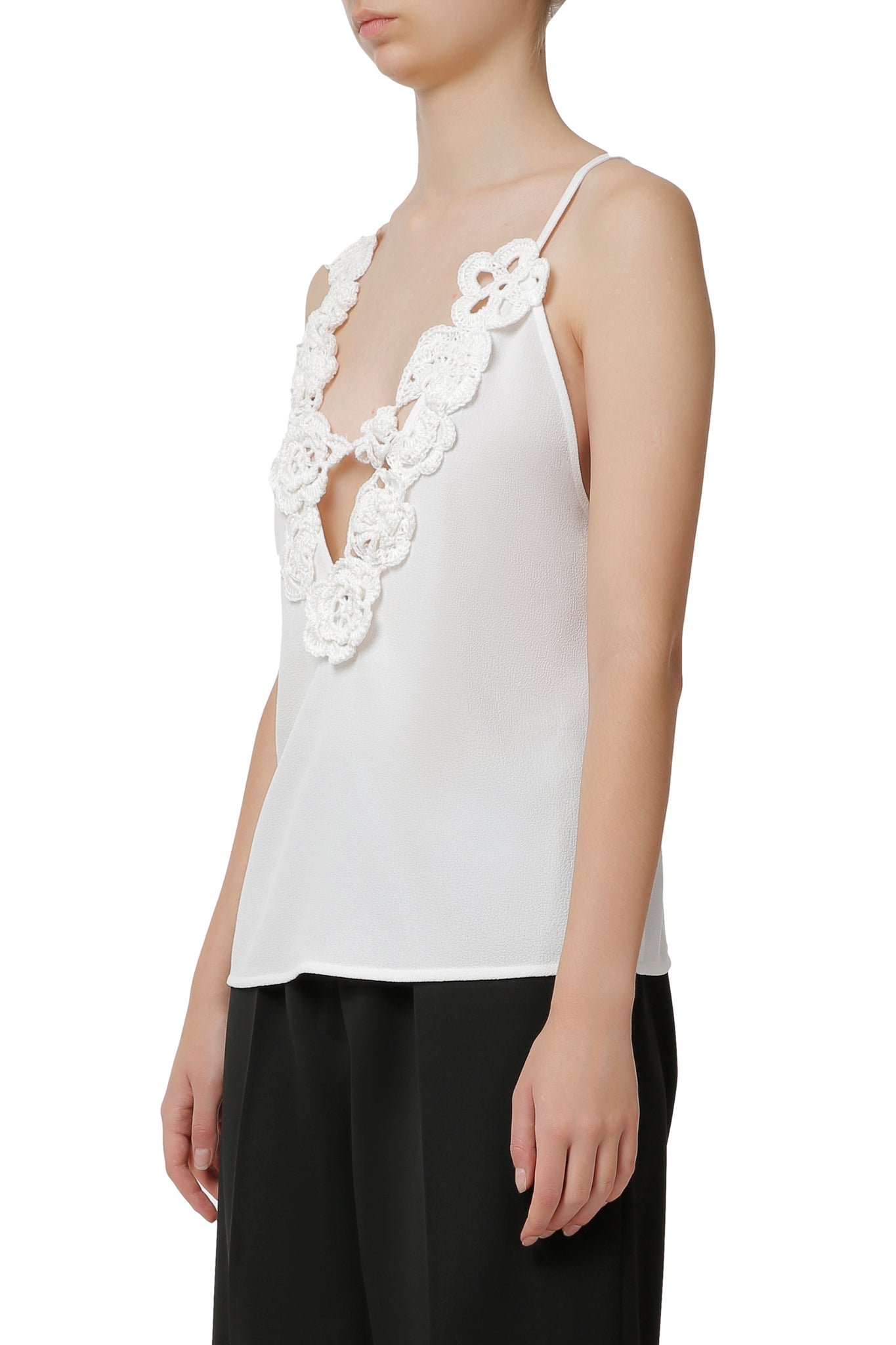 White top  with hand-knit details