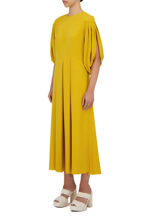 Жовта сукня міді
